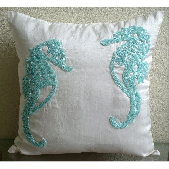 http://www.thehomecentric.com/cdn/shop/products/sea-horse-aqua-white-silk-creatures-beach-style-beaded-designer-pillow-covers_1200x1200.jpg?v=1573238606
