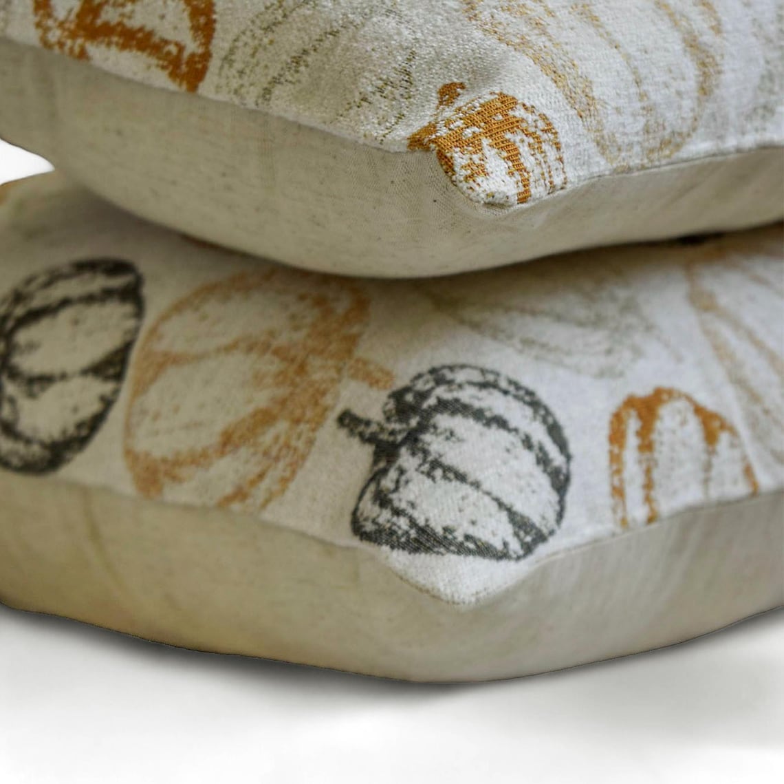 Side view of the woven jacquard Halloween pumpkin & fall decor lumbar pillow cover by The HomeCentric on a white background