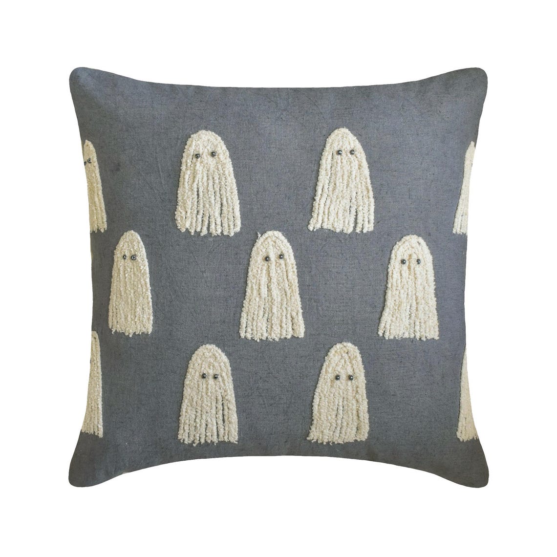 Embroidered ghost design pillow on a gray fabric. 