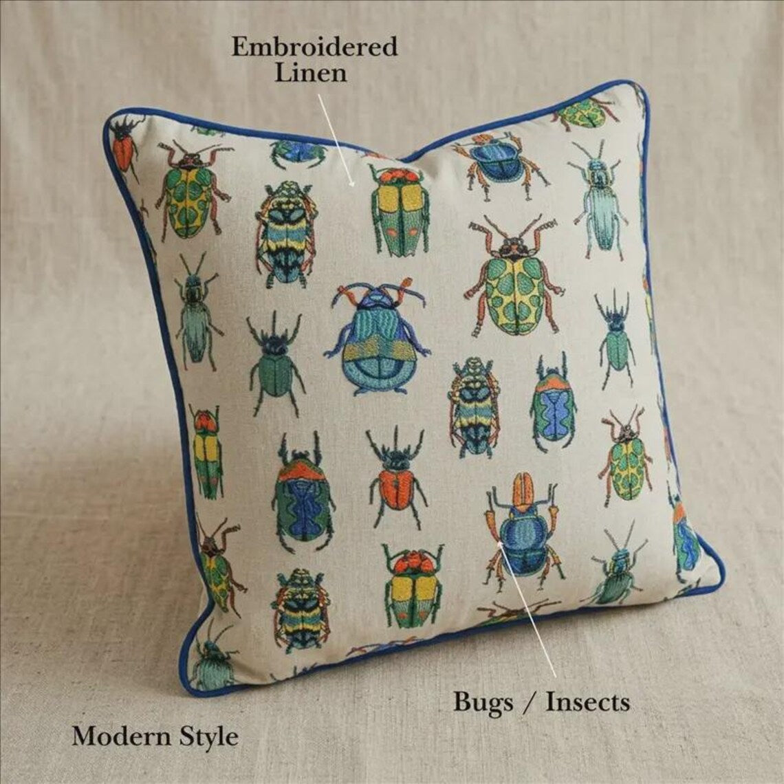 Beetle-printed pillow cover on a black chair with a checkered blanket, perfect for an eclectic home decor look.