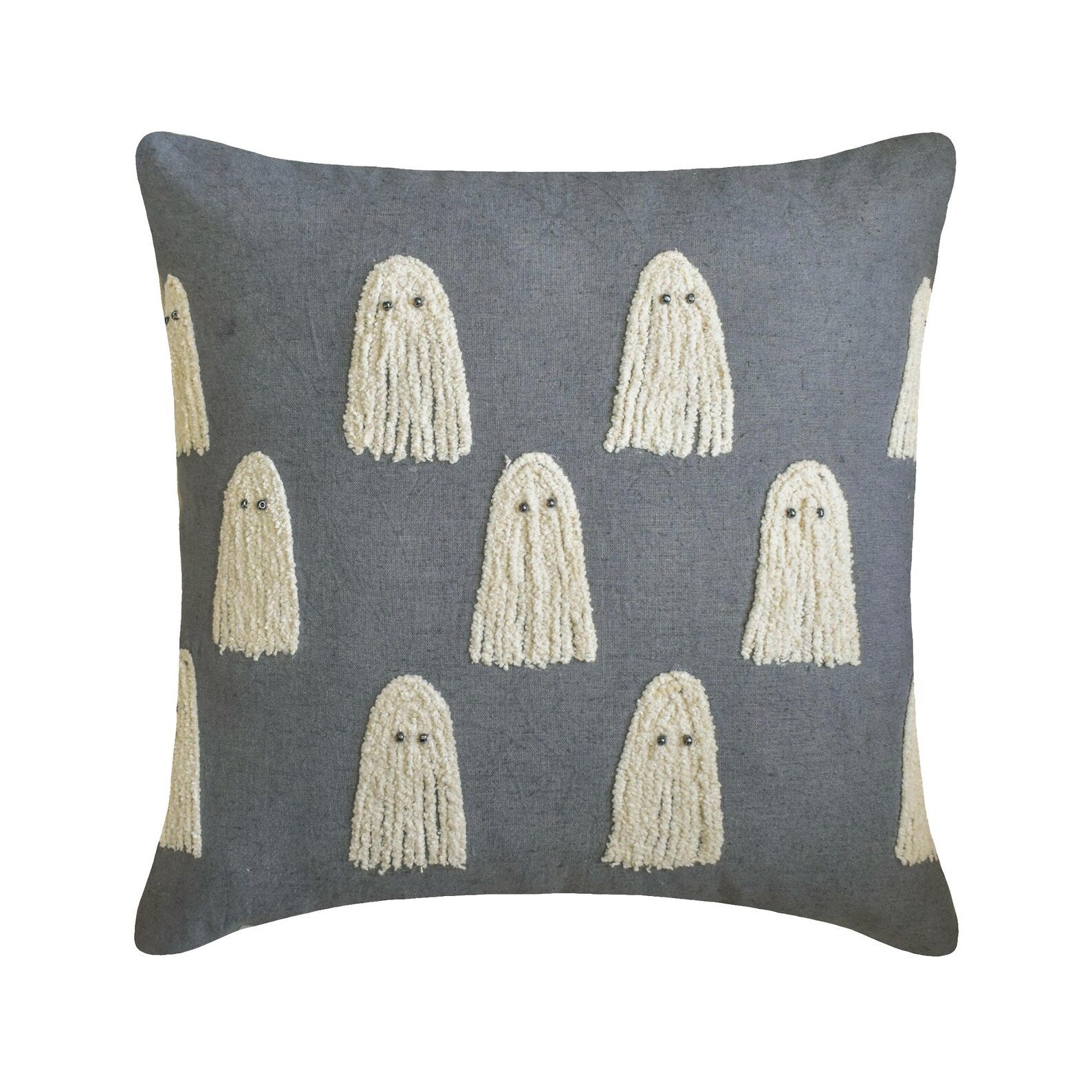 Cozy Halloween decorative pillow covers display with various spooky, haunting and scary Halloween themed placed in a cozy setting with pumpkin decor and spider web.
