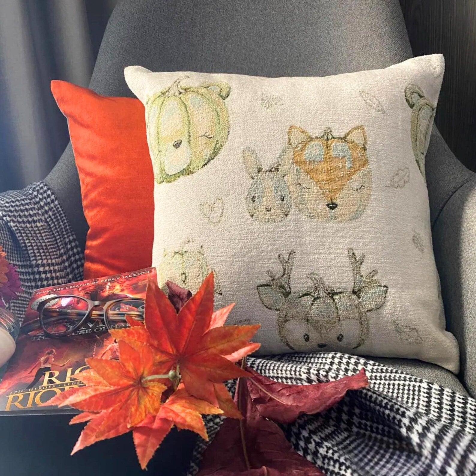 Fall Halloween home decor pillow cover, A woven jacquard throw pillow cover with pumpkin fox design and subtle fall colors for Autumn Decor. Square woven cushion cover for autumn season. A product image on a white setting showcasing the pillow cover design.  Handcrafted pillow cover from The HomeCentric's Fall Collection.