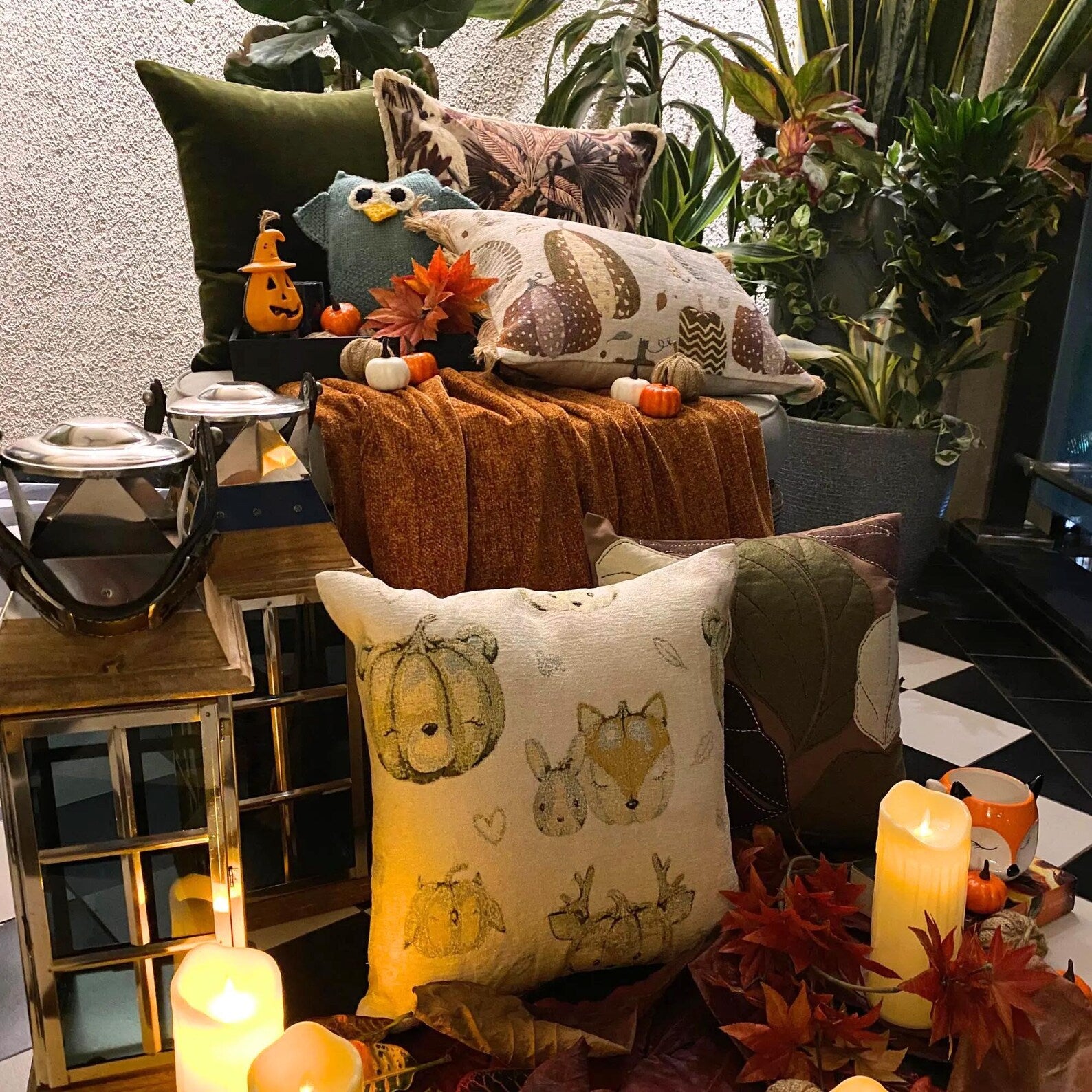 A beige square throw pillow with a white label that says 'THEHOMECENTRIC', a back cover view of the woven jacquard pumpkin fox pillow cover. A solid back cover for the autumn decor cushion cover.