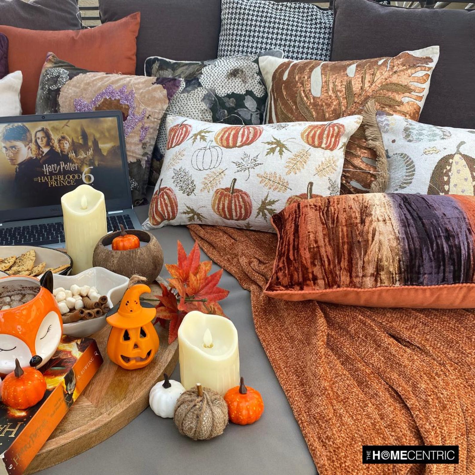 Olive green maple leaves, orange pumpkins, beige woven jacquard decorative oblong cushion cover by The HomeCentric for rustic country homes featured on a white background. 
