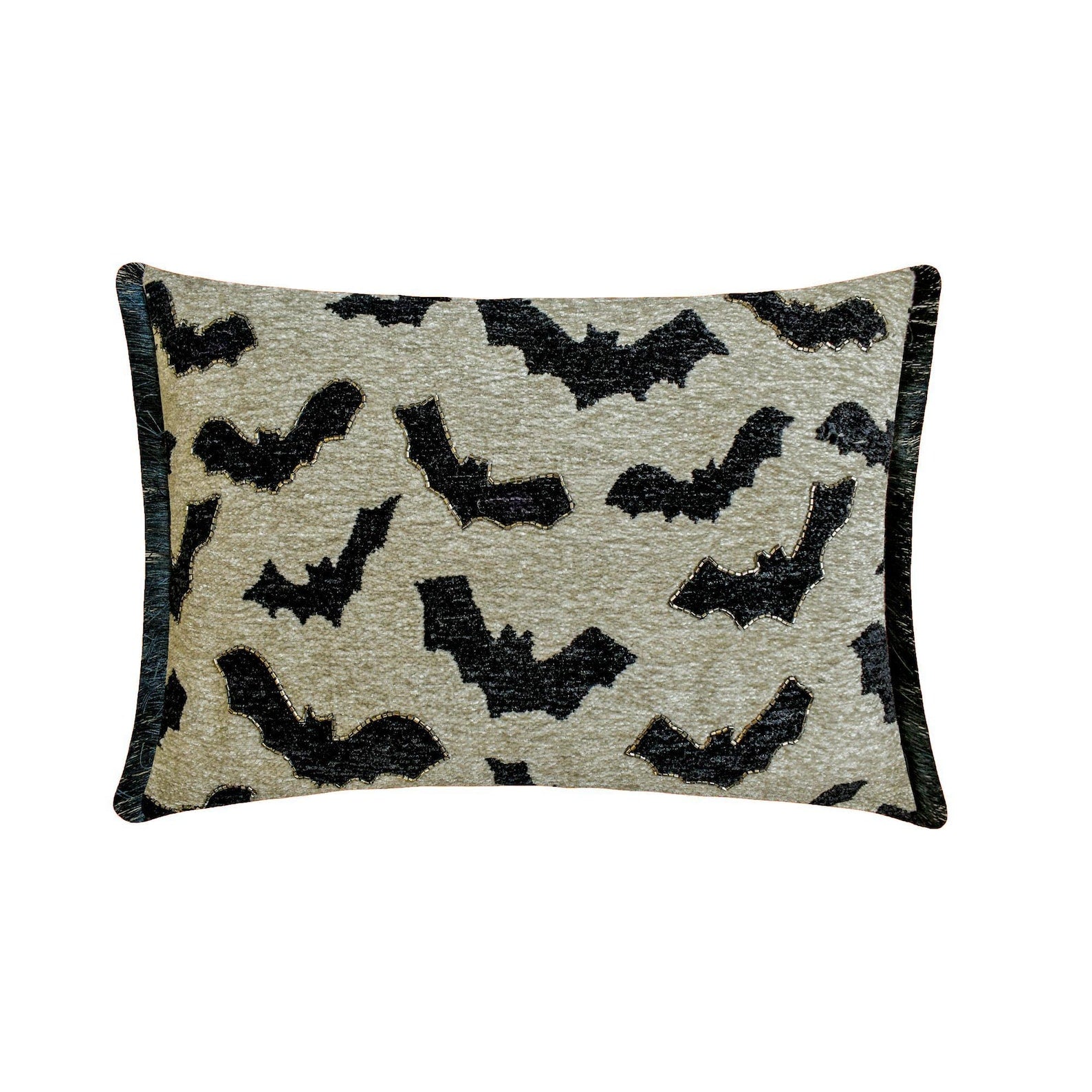 A collection of Halloween-themed pillows with ghost, bat, and cat patterns arranged on a red sofa, with decorative skulls, pumpkins, and cauldrons emitting fog.